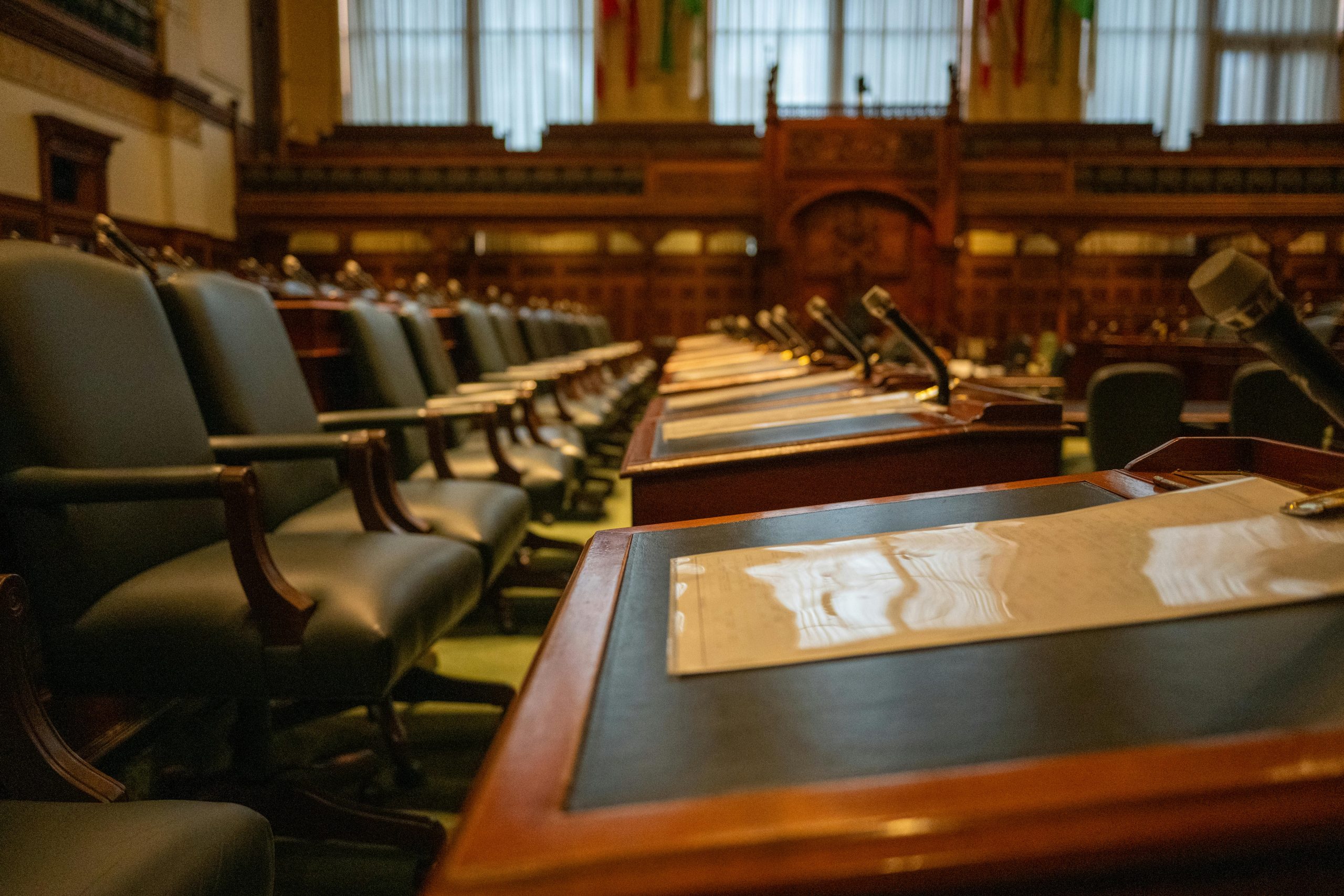 Council meeting room with large conference table, microphones and chairs arranged for a local authority SEND strategy discussion.